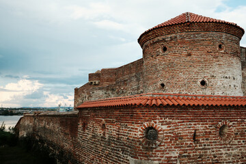 Close-up of the rounded corner tower of Fetislam Fortress in Serbia, showing brick textures and...