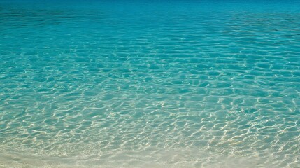 Obraz premium Crystal Clear Turquoise Ocean Water Texture Background