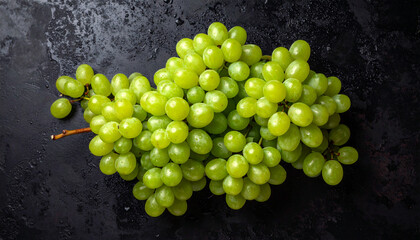 the image features a cluster of green fruit on a dark, textured background. several bunches of the spherical fruit are clustered together, filling much of the frame