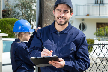 portrait of electrician workers outdoors