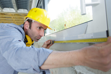 handyman is working on renovation of apartment