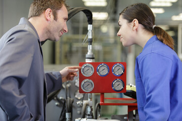 engineers in steel factory working together