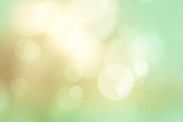 Obraz premium Soft pastel bokeh background in light green, cream, and white tones with gentle glow
