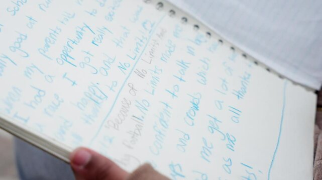 Camera reveals colored-pencil words as focus shifts across book page