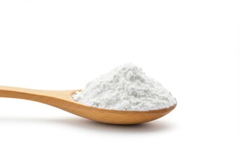 Wooden spoon filled with white powder against a white background