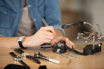 watchmaker repairing an old pocket watch