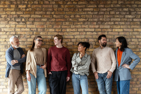 Diverse Group of Professionals Smiling Together - Powered by Adobe