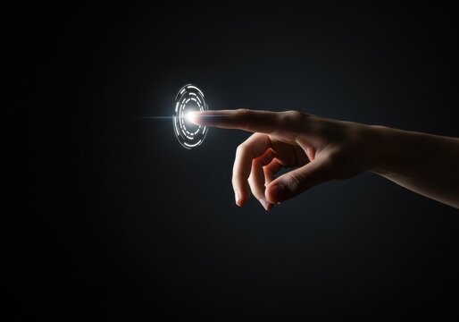 A finger touches a glowing circular interface on a dark background