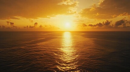 Fototapeta premium Golden sunset over tranquil ocean waters.