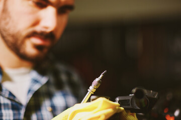 Technician repairing electronic device with precision screwdriver
