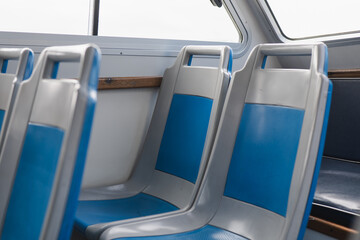 Interior of a bus showcasing modern seating design with a clean aesthetic