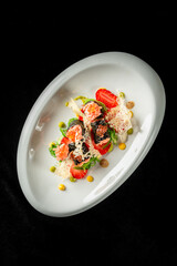 Gourmet sushi dish with salmon roe, seaweed, strawberries, and artistic sauces on a white plate against black background. Elegant plating, vibrant colors, and fine dining presentation.
