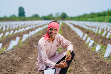 happy farmer at small banana agriculture field