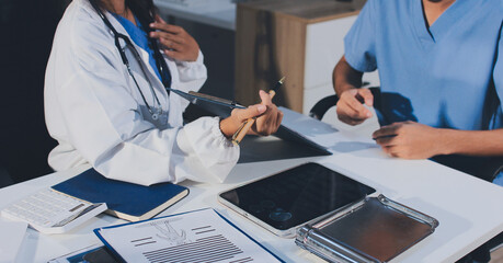 Young brunette woman having consultation at doctor office during