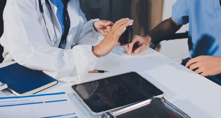Young brunette woman having consultation at doctor office during