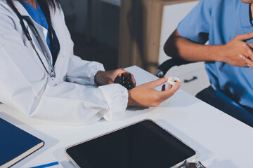Young brunette woman having consultation at doctor office during