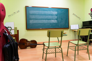 Music classroom ready for students learning instruments and theory