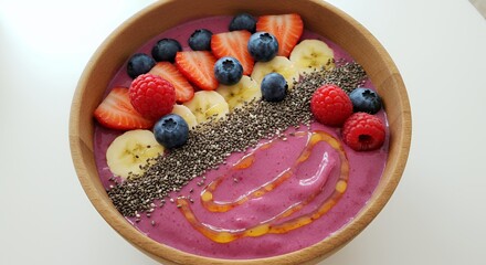 Indulge in this vibrant berry smoothie bowl, topped with fresh fruit and chia seeds ? a healthy and delicious start to your day.