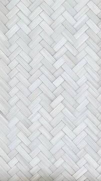 Woven bamboo texture background showing interwoven light gray and white strips forming a seamless herringbone pattern