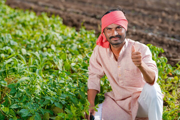 Indian farmer showing thumps up