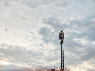 Cellular Tower Against a Dramatic Sunset Sky A View of Modern Communication Infrastructure