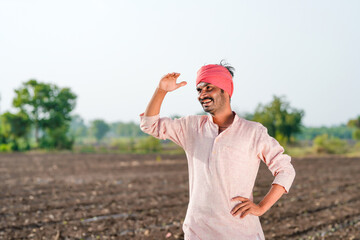 farmer standing at agriculture field and waiting some one