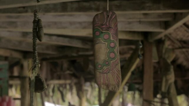 Medium shot of decorative waste with broken tv at a Darien Gap rustic house in Colombia.