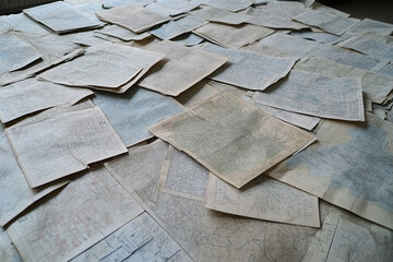 Vintage map collection displayed on table with intricate details