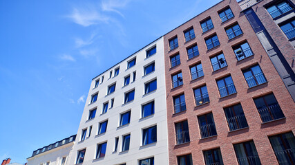 Modern apartment buildings on a sunny day with a blue sky. Facade of a modern apartment building....