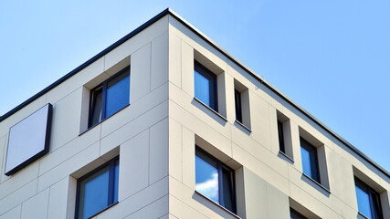 Modern apartment buildings on a sunny day with a blue sky. Facade of a modern apartment building. Modern residential apartment building complex condo.