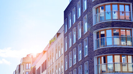 Modern apartment buildings on a sunny day with a blue sky. Facade of a modern apartment building....