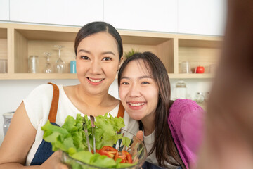 Happy Moments: Women Taking Selfie with Fresh Salad in Kitchen