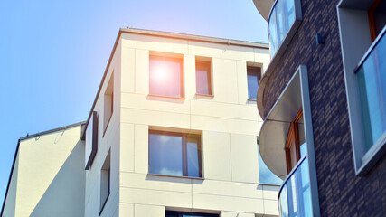 Modern apartment buildings on a sunny day with a blue sky. Facade of a modern apartment building....