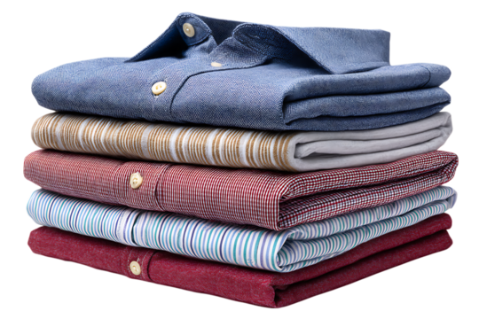 Stack of folded men s dress shirts in various patterns and colors isolated on transparent background