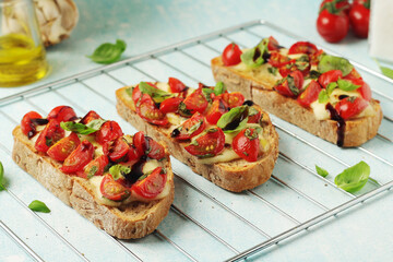 Freshly made bruschetta sandwiches - traditional dish of Italian cuisine	