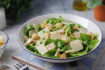 A bowl with classic Caesar salad	