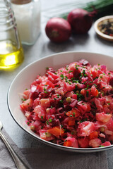 A bowl with Vinegret salad, a typical Russian dish
