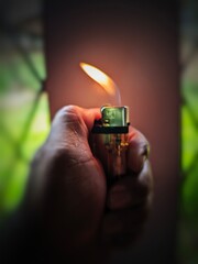 Close-up of a Hand Holding and Lighting a Lighter