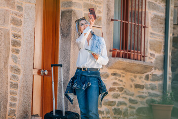 woman traveling walking with suitcase or luggage