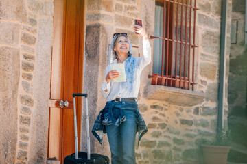 woman traveling walking with suitcase or luggage