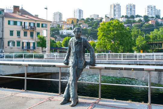 Rijeka, Croatia - June 10, 2025: Bronze statue of Janko Polić Kamov by the canal in Rijeka, Croatia