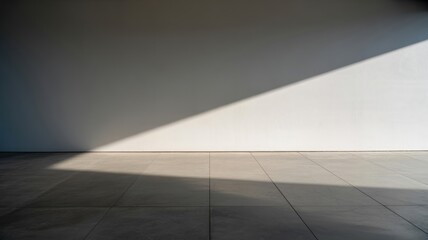 Fototapeta premium Minimalist interior with sunlight casting geometric shadows on tiled floor