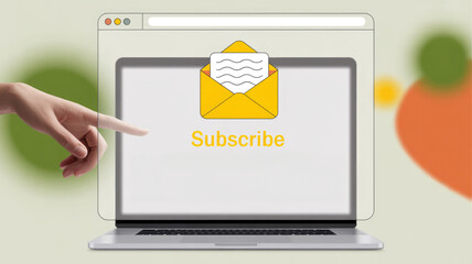 A laptop screen with a yellow envelope and a hand pointing to the word "subscribe" on the screen