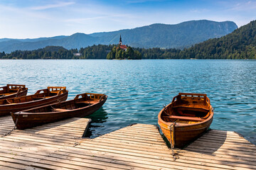 boats anchored on Lake Bled - island with church in the background