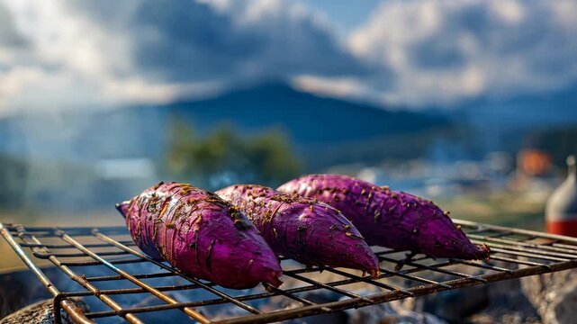 Grilled purple sweet potatoes over mountain campfire
