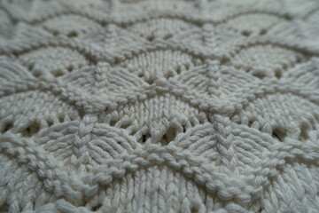 Closeup of white wavy knitted lace fabric