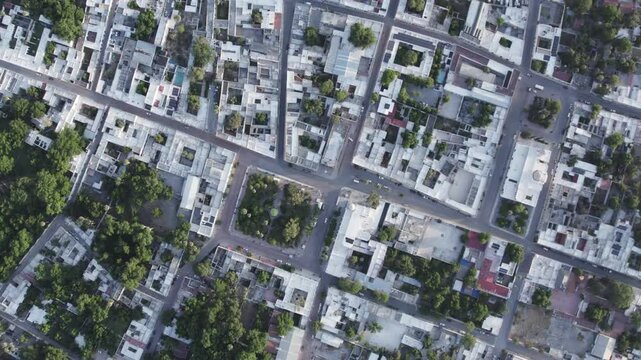 Drone footage at sunrise over Parras de la Fuente, showing urban layout and surrounding terrain under clear sky conditions, captured in stable 4K resolution with smooth tracking and overhead shots.