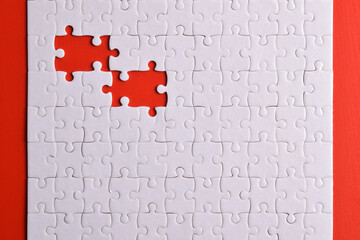 White puzzle with missing piece on red background. Flat lay. Top view