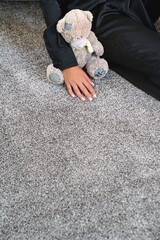 a woman's hand touching the grey Interior pile carpet