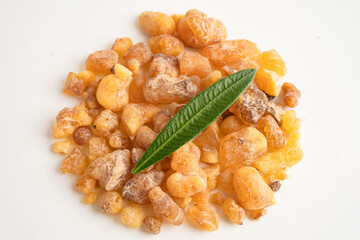Frankincense or olibanum aromatic resin isolated on white background used in incense and perfumes.